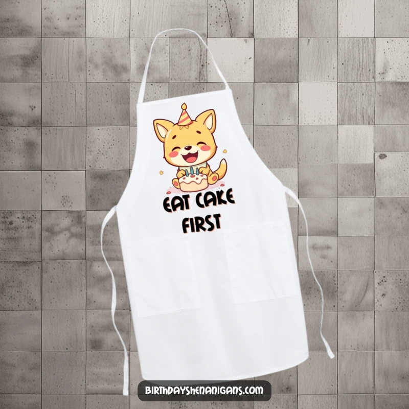 Funny kitchen apron with a delighted dog wearing a birthday bib, gleefully smashing a tiny cake, ready for party messes.