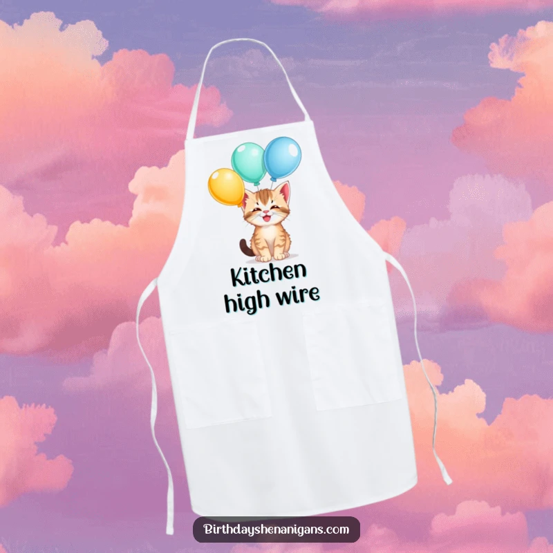 Funny kitten kitchen apron, giggling, balancing balloons, playful cooking attire, cute cat, humorous.