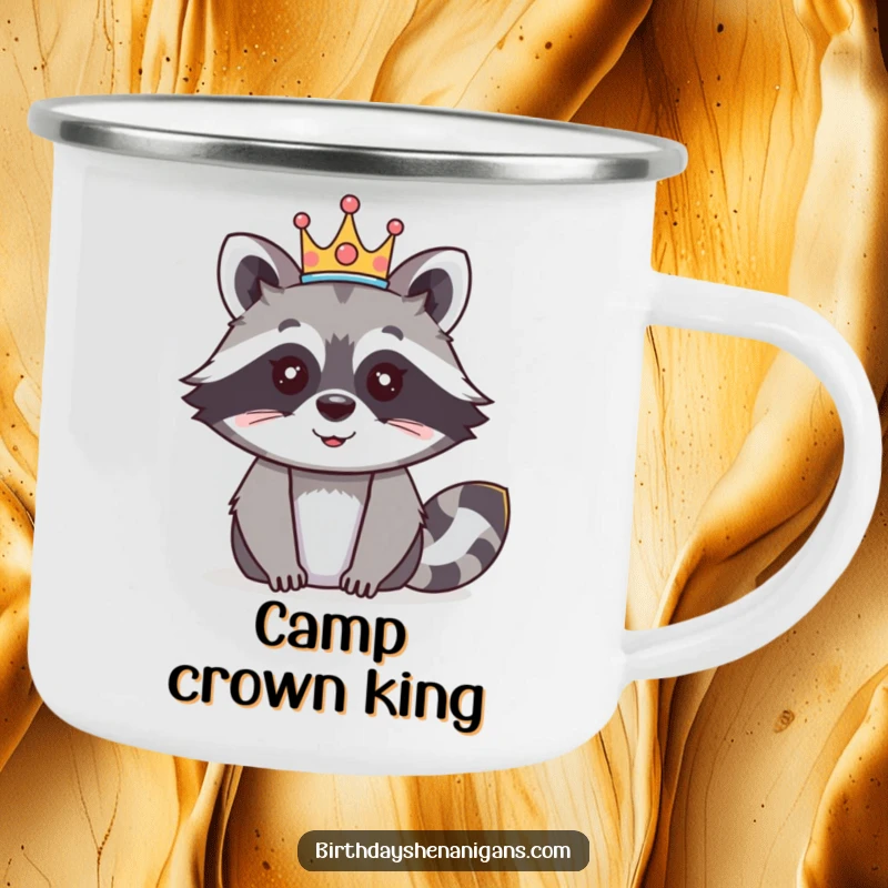 Funny raccoon camping mug featuring a happy character wearing a festive crown, designed for royal outdoor experiences.