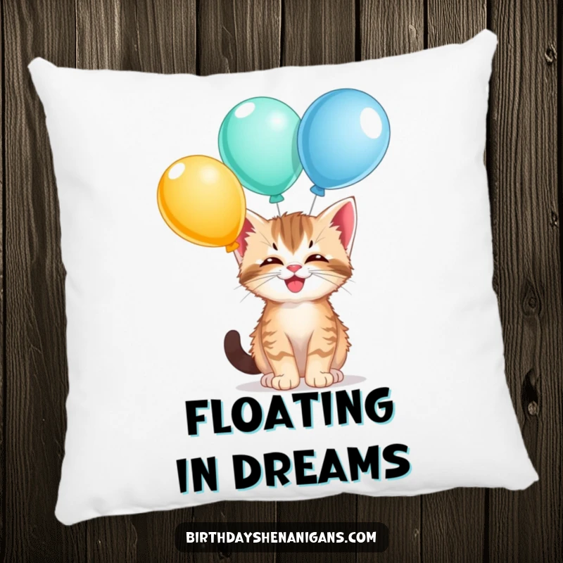Funny kitten pillow, comfy, giggling, balancing balloons, playful accent, cute cat, soft and humorous.