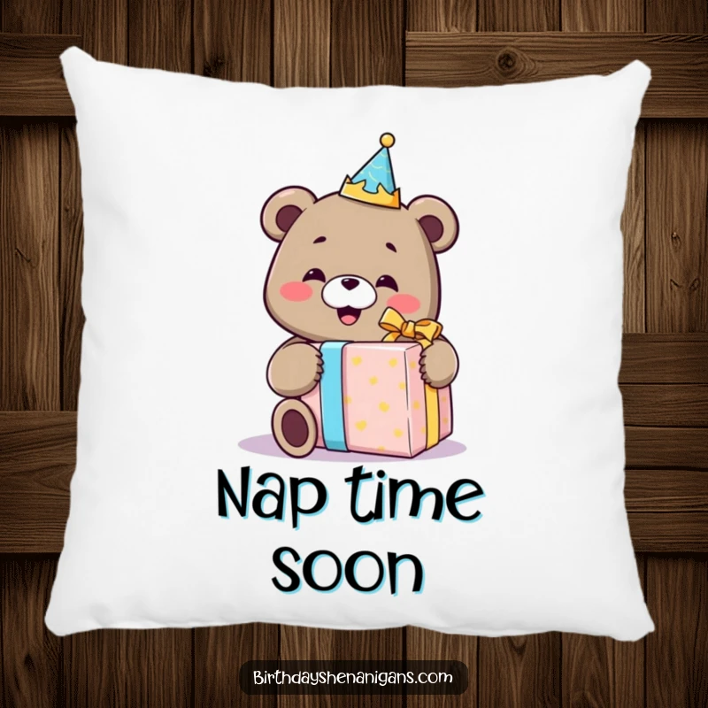 Funny pillow featuring a smiling bear wearing a birthday crown, happily unwrapping a comically large gift, adding comfort and humor.