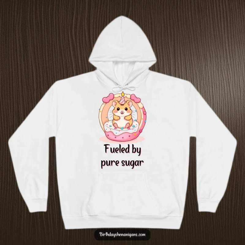 Funny kawaii hamster character inside a rolling birthday cake, featured on a warm and cozy hoodie.