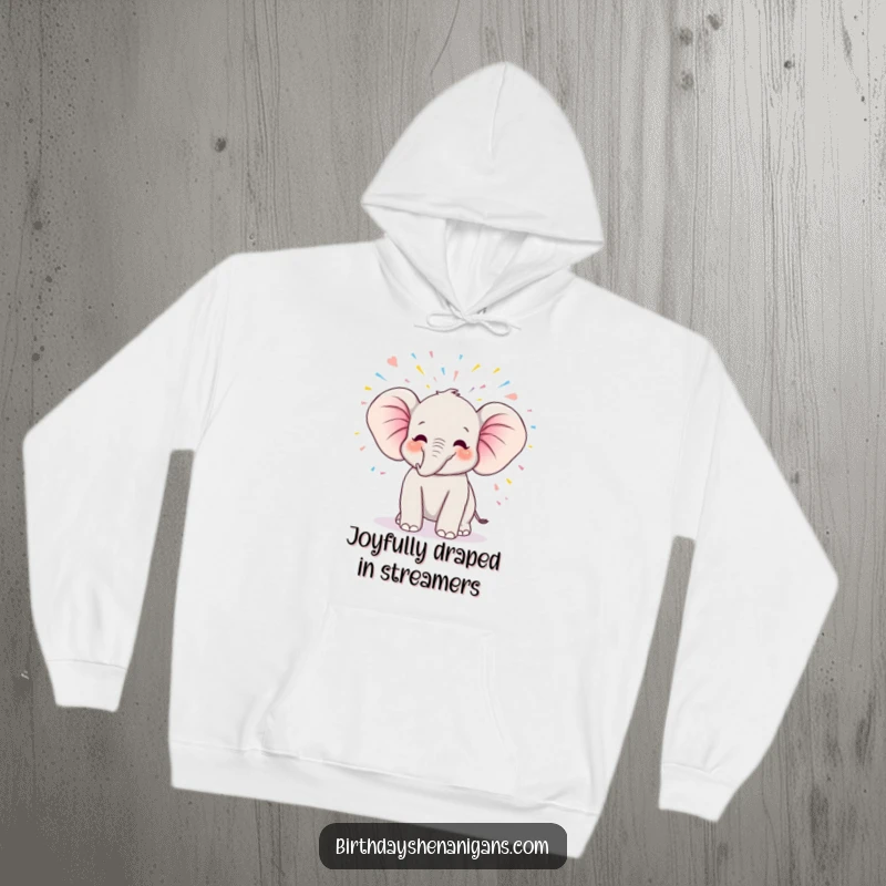 Funny kawaii elephant celebrating a birthday, trumpeting joyfully amidst a cascade of streamers, featured on a cozy hoodie.