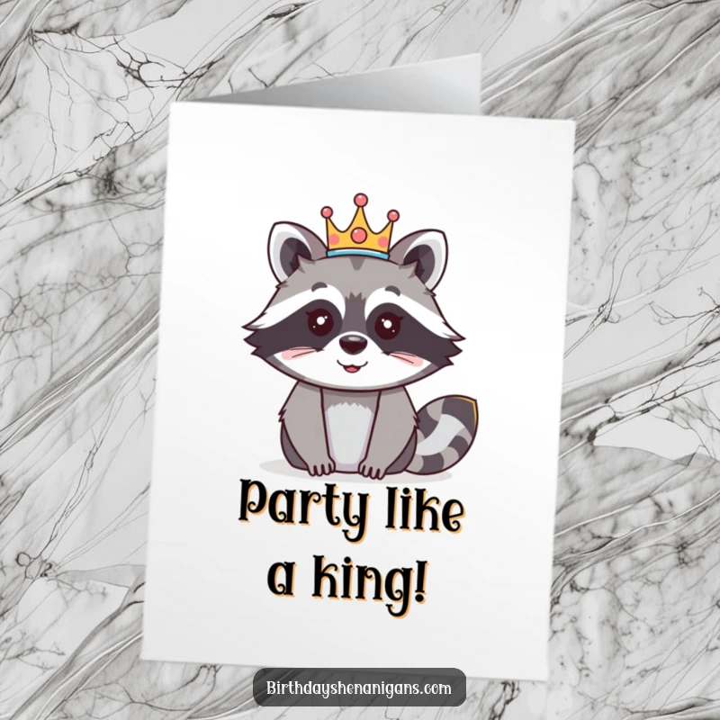 Funny Free Printable Birthday Card: A happy raccoon sports a festive crown, ready to celebrate a 'royal' birthday.