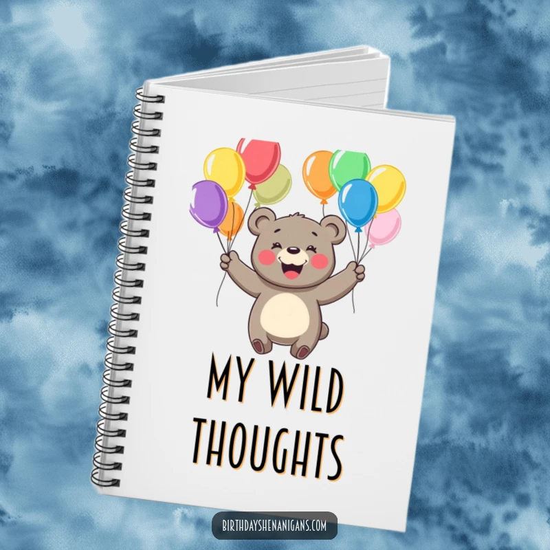 Funny notebook featuring a cheerful bear with a big smile, juggling colorful balloons, perfect for notes and ideas.