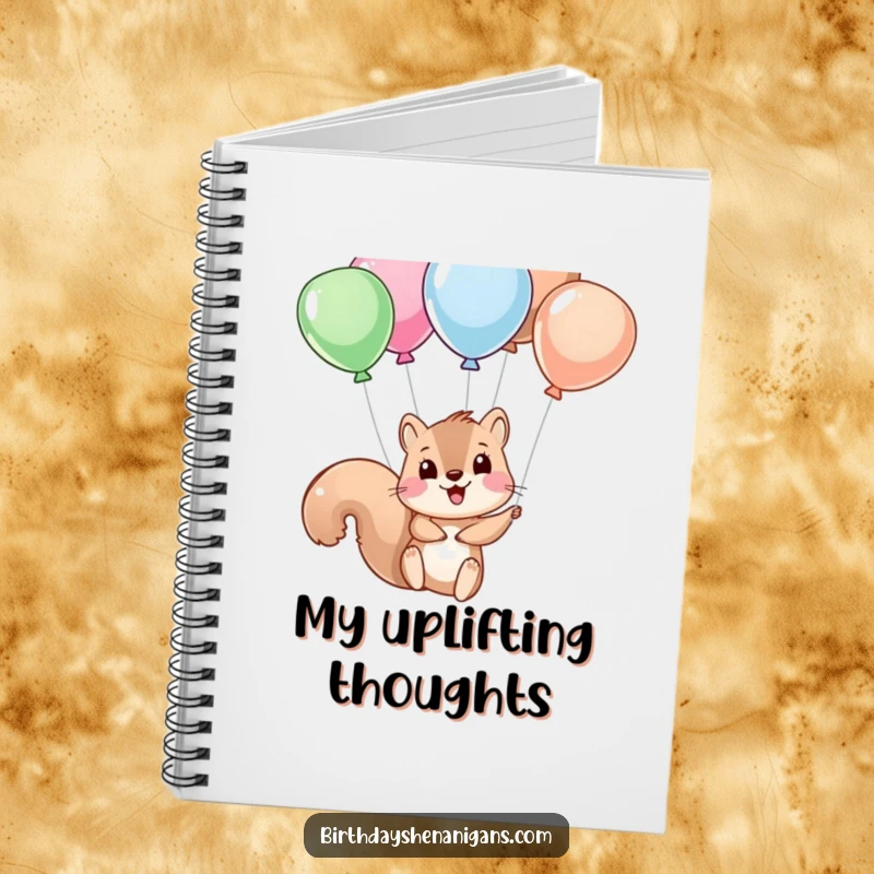 Funny squirrel character dangling from balloons, featured on a notebook cover for inspiring creative and humorous thoughts.