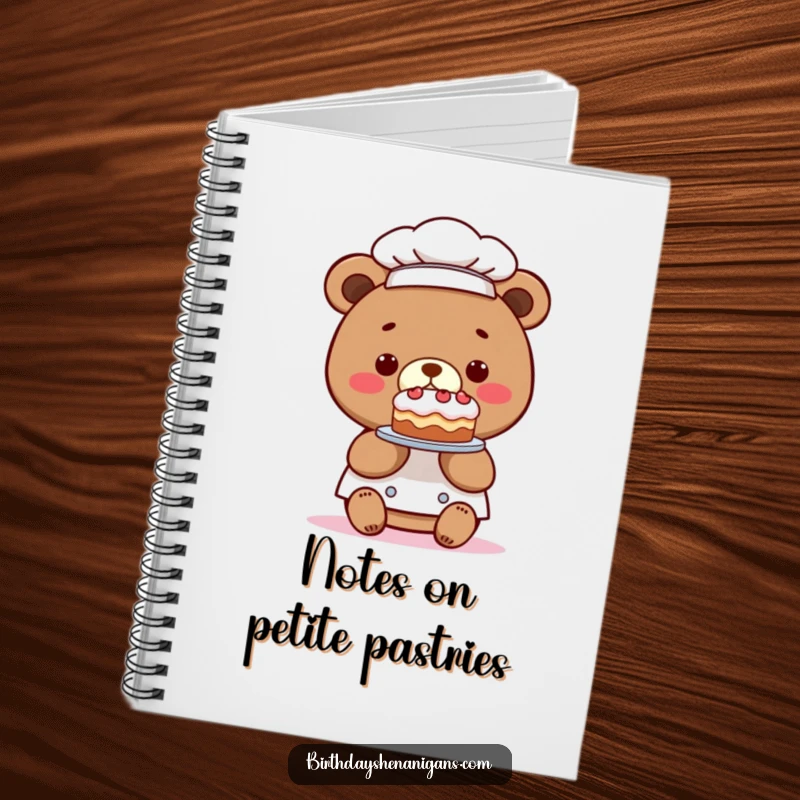 Funny notebook featuring a kawaii bear chef with a comically tiny cake, perfect for jotting down recipes and humorous thoughts.