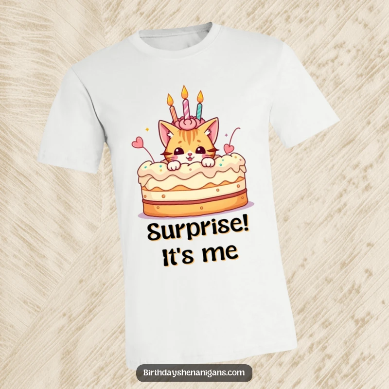 Funny t-shirt showing a playful cat character emerging from a giant birthday cake, adding a touch of whimsical fun.