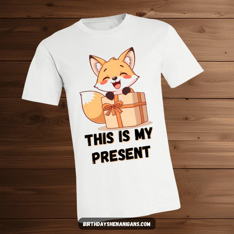 Funny t-shirt with a smiling fox character eagerly unwrapping a comically large present, capturing the essence of gift-giving joy.