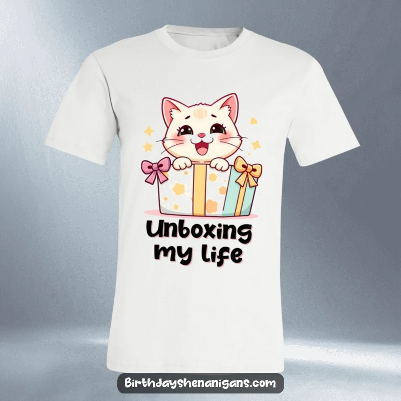 Funny t-shirt depicting an ecstatic cat character tearing into a massive present, showcasing pure feline delight and unboxing joy.